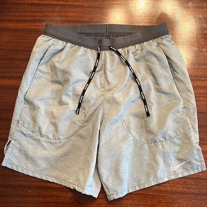 Men’s Nike Stride Dri-FIT 7” unlined running shorts size small color is grey